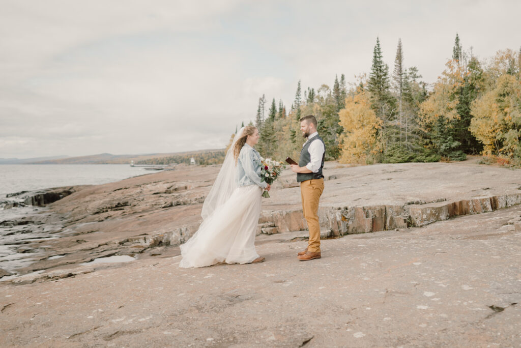 couple stand on Artist's Point and exchange vows