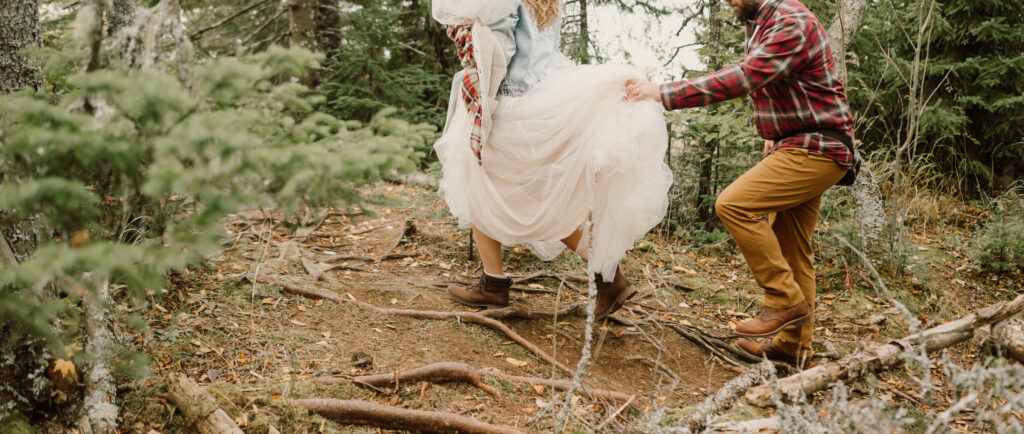 The elopement couple hiking on the trails.