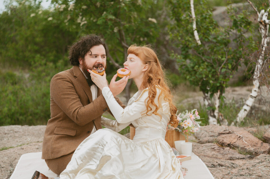 bride and groom eat the donuts