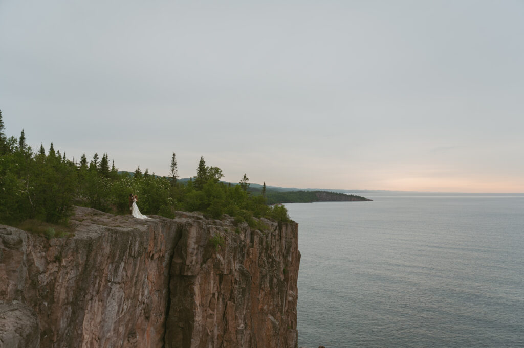 Scenic View elopement couple stand on the cliff