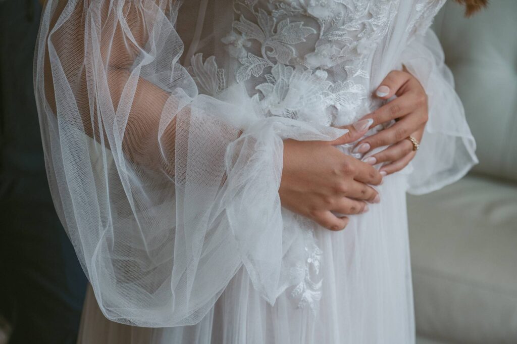 cozy elopement couple cuddle together