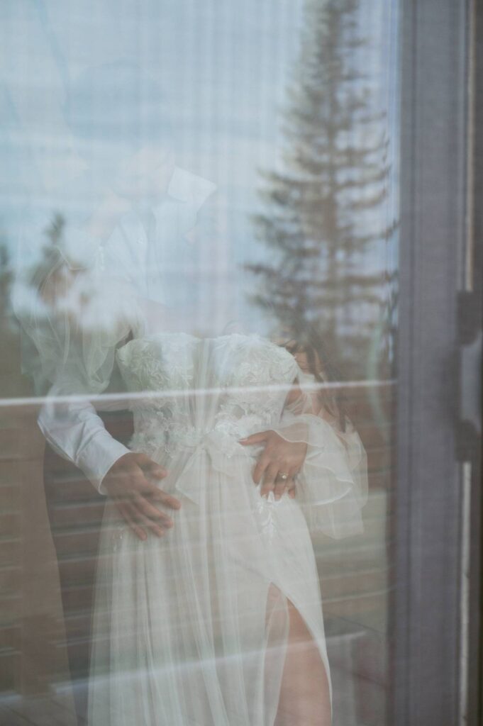 cozy elopement couple cuddle up together