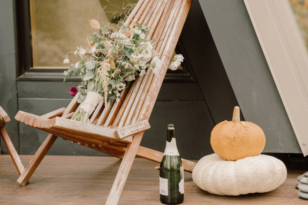 a bouquet of flowers with the pumpkins