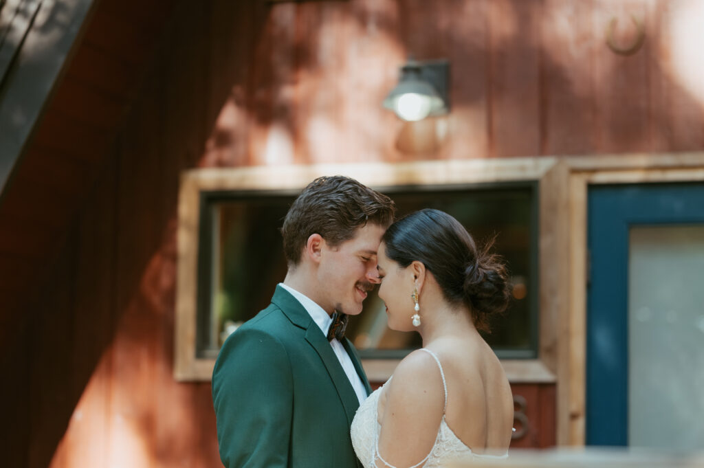 couple touches each other's forehead and hugging